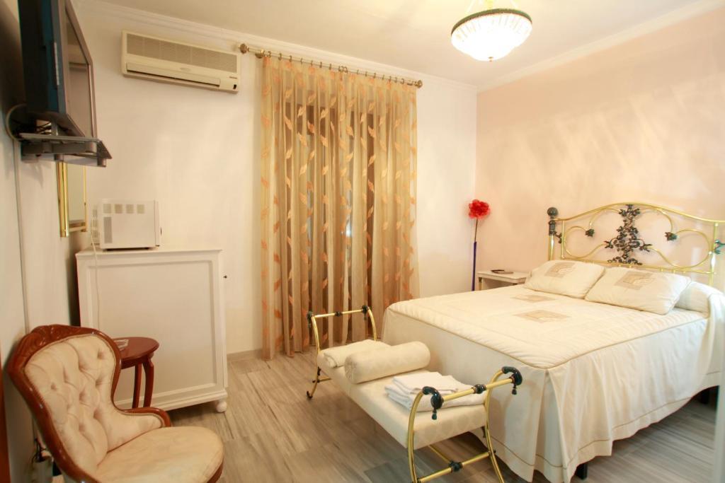 Hostal Jimenez Azuaga Rum bild