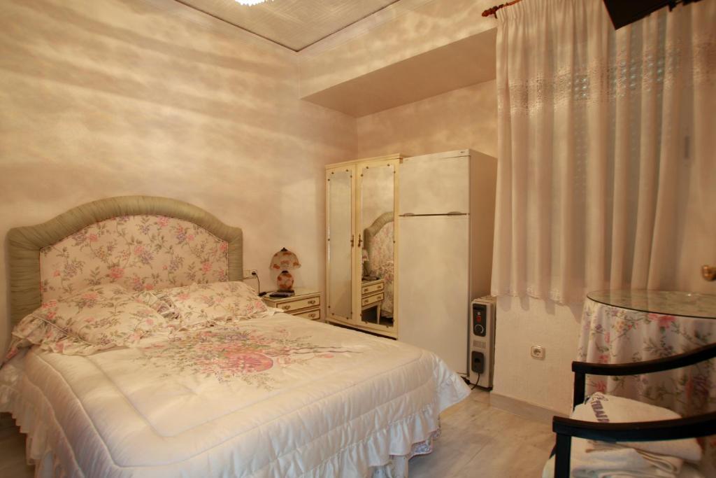 Hostal Jimenez Azuaga Rum bild