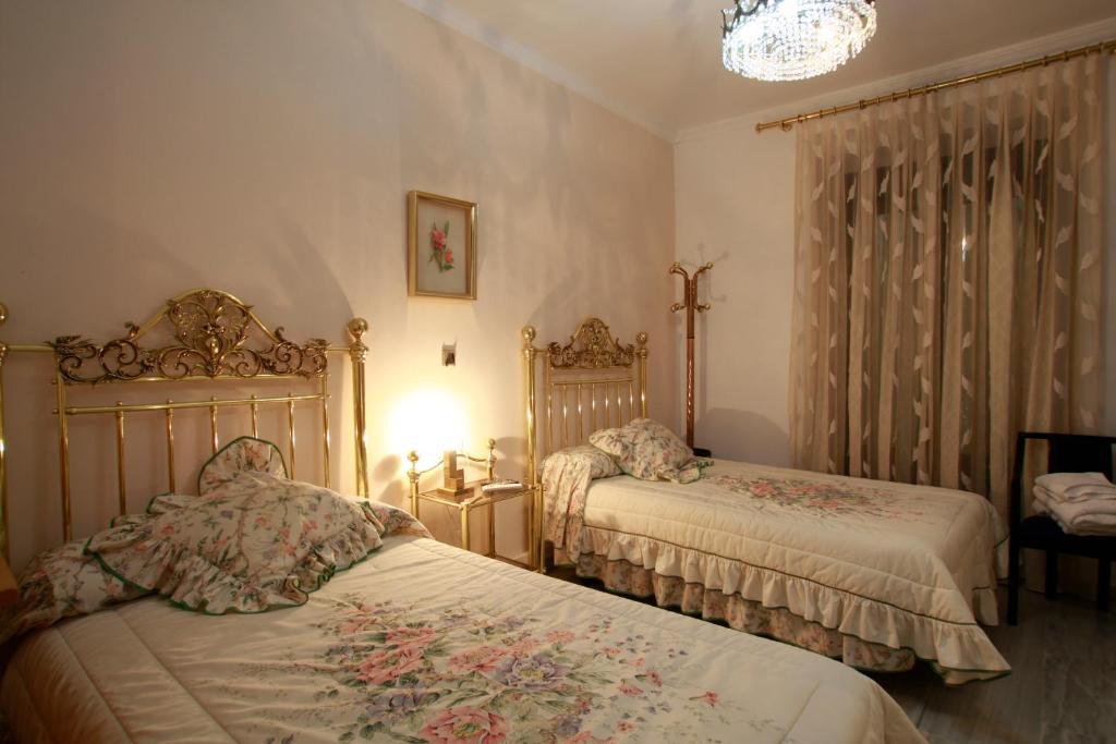Hostal Jimenez Azuaga Rum bild