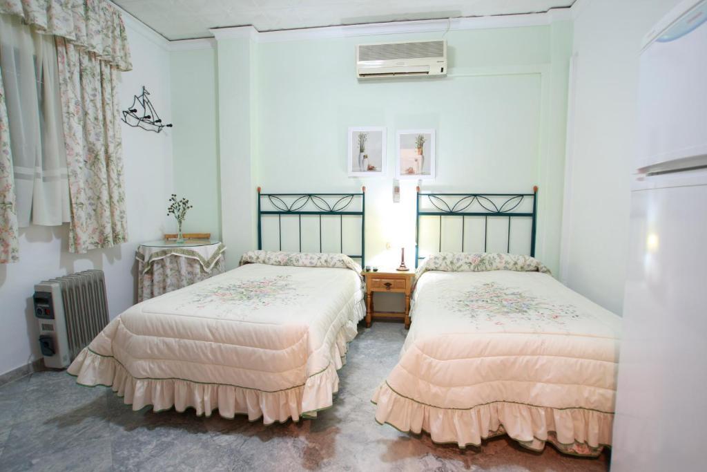 Hostal Jimenez Azuaga Rum bild